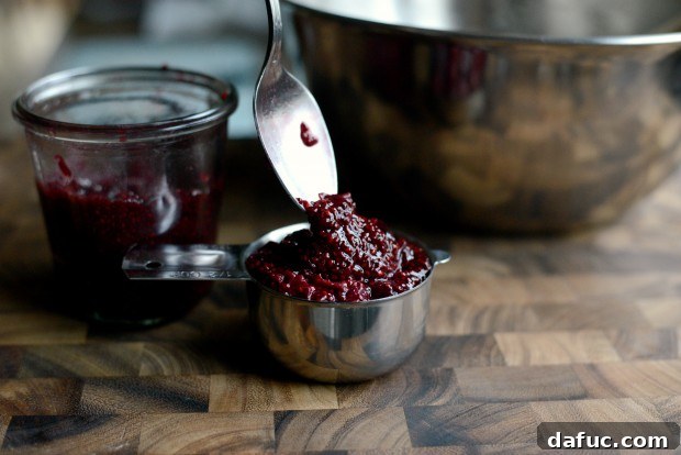 Sweet Cherry Almond Crumble Bars 15 A generous scoop of vibrant cherry jam in a bowl