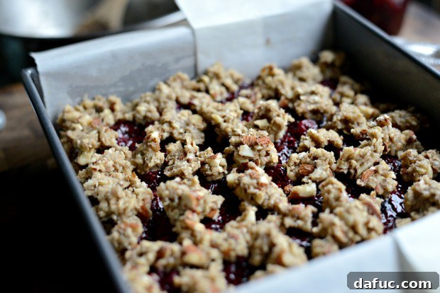 Sweet Cherry Almond Crumble Bars 18 Dropping almond-studded crumble dough over the jam layer