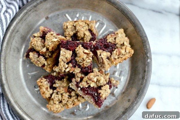Sweet Cherry Almond Crumble Bars 23 Cherry Jam Almond Crumble Breakfast Bars cut into squares