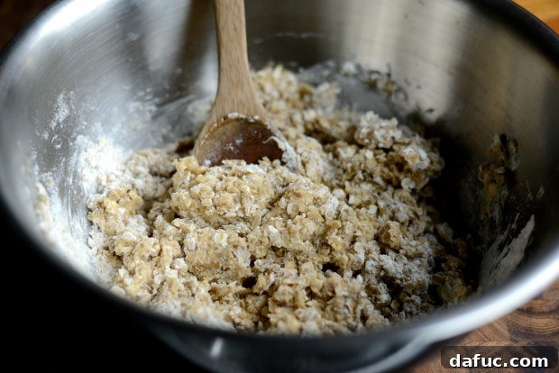 Sweet Cherry Almond Crumble Bars 10 Mixing wet and dry ingredients until a cohesive dough forms