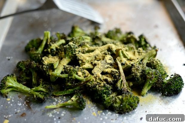 Savory Roasted Broccoli with Toasted Peanuts 13 Roasted broccoli being drizzled with rice vinegar.