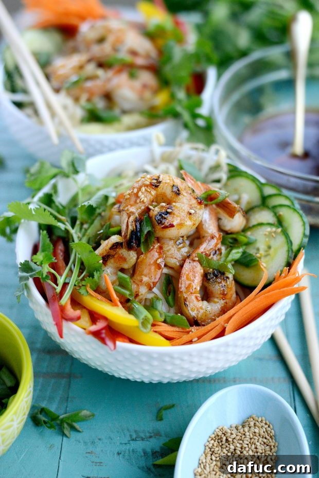 Vibrant Grilled Shrimp Spring Roll Noodle Bowls 3 Close-up of fresh ingredients for the spring roll noodle bowls, including bell peppers, cucumbers, and cilantro.