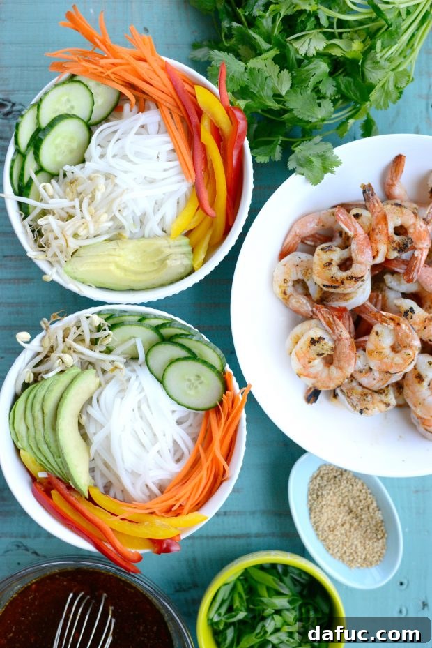 Vibrant Grilled Shrimp Spring Roll Noodle Bowls 10 Assembled noodle bowl with rice noodles, fresh vegetables, and avocado arranged beautifully.