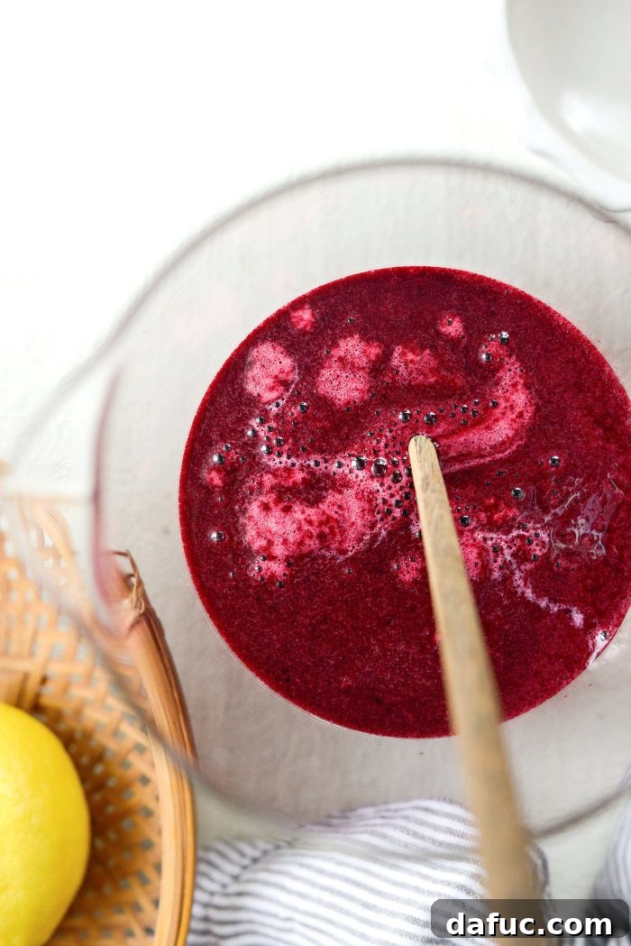 Stirring the blueberry lemon mixture and wine simple syrup together