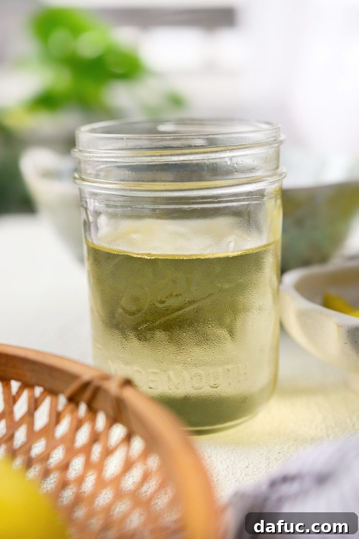 Homemade white wine simple syrup in a glass jar