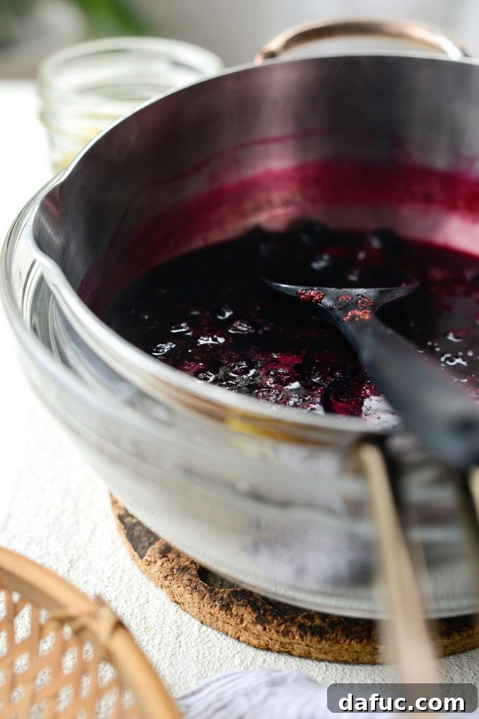 Cooling the cooked blueberry lemon mixture in an ice bath