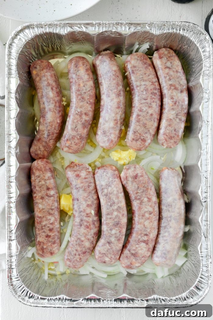 Adding brats to onions, garlic, and butter in a pan
