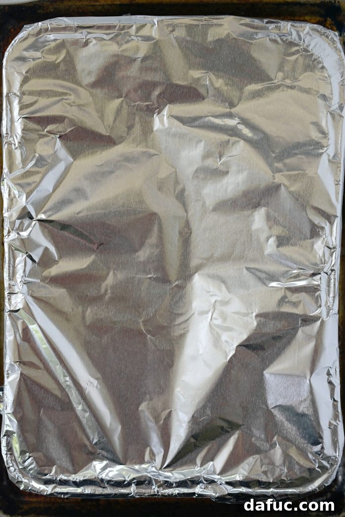 Brew-Braised Oven Brats 8 cover with heavy duty aluminum foil