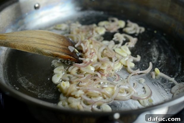 Adding more butter to the sautéed aromatics