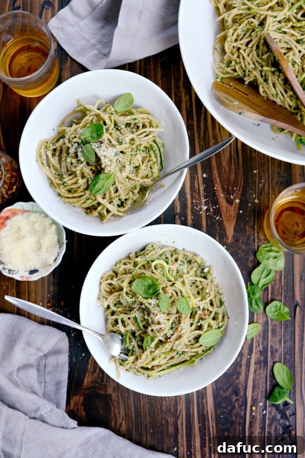 Overhead shot of spaghetti with zucchini and spinach almond pesto sauce