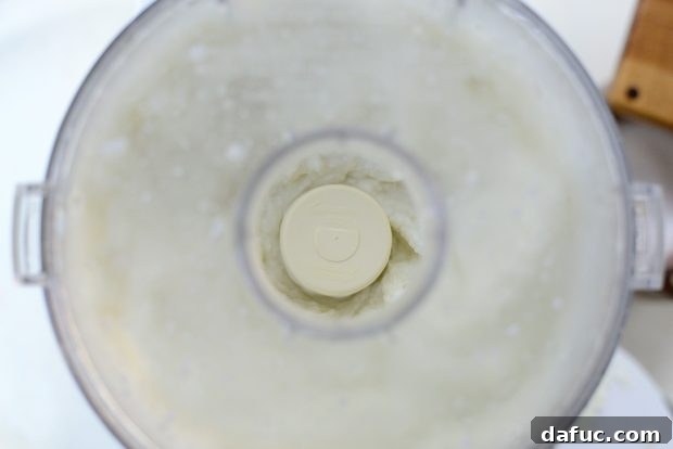 Creamy Lebanese Toum 13 Toum gradually thickening in the food processor.