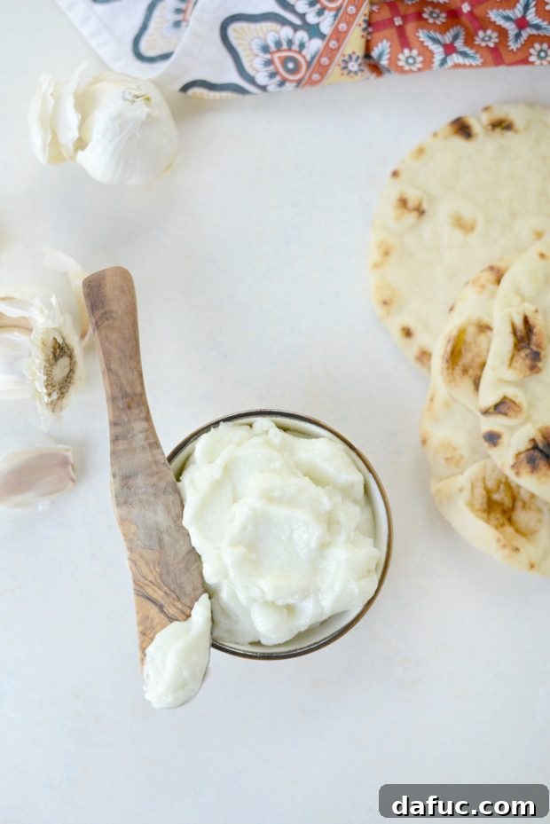 Creamy Lebanese Toum 19 Toum served with Middle Eastern dishes.