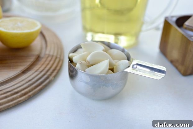 Creamy Lebanese Toum 5 Peeled garlic cloves ready for the food processor.