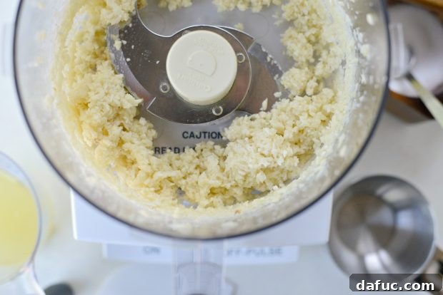 Creamy Lebanese Toum 7 Finely chopped garlic and salt in a food processor.