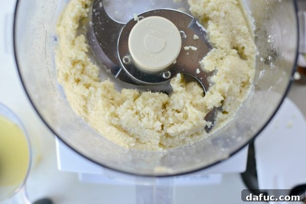 Creamy Lebanese Toum 9 Finely minced garlic after a second round of pulsing.