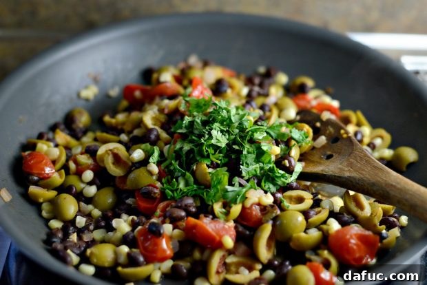 Grilled Red Snapper with a Vibrant Fiesta Olive Medley 13 Adding fresh chopped cilantro to the warm fiesta olive topping.