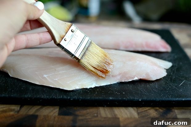 Grilled Red Snapper with a Vibrant Fiesta Olive Medley 15 Brushing red snapper fillets generously with extra light olive oil before grilling.