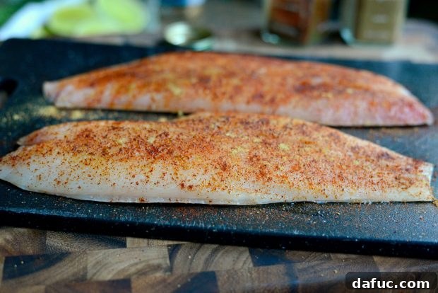 Rubbing Spices into Red Snapper Fillets