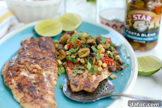 Grilled Red Snapper with a Vibrant Fiesta Olive Medley 22 Another view of the beautifully plated grilled red snapper with the warm fiesta olive topping, emphasizing its appeal.