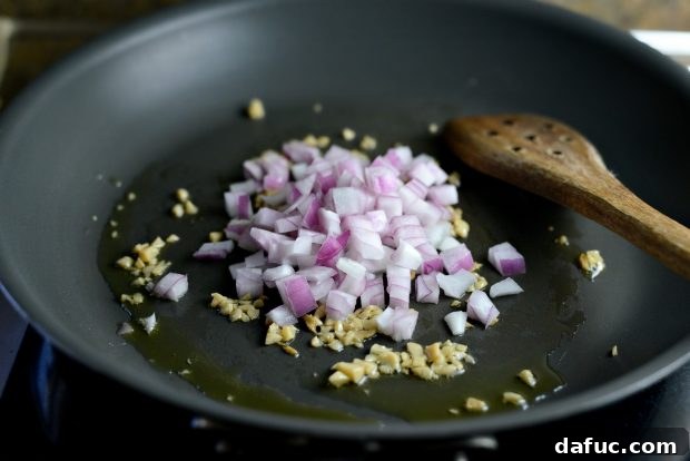 Adding Diced Red Onion to the Skillet