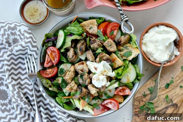 Delicious Chicken Tawook Salad with grilled chicken, fresh vegetables, and lemon sumac dressing