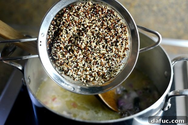 Golden Moroccan Quinoa Pilaf 12 Adding Rinsed Quinoa to the Pot