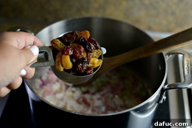 Golden Moroccan Quinoa Pilaf 7 Adding Raisins to the Pilaf Base