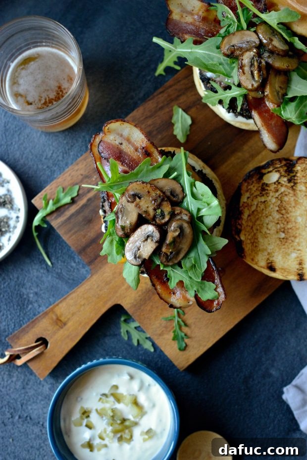 Juicy Peppercorn Crusted Burger, Bacon, Mushrooms, and Dill Pickle Aioli
