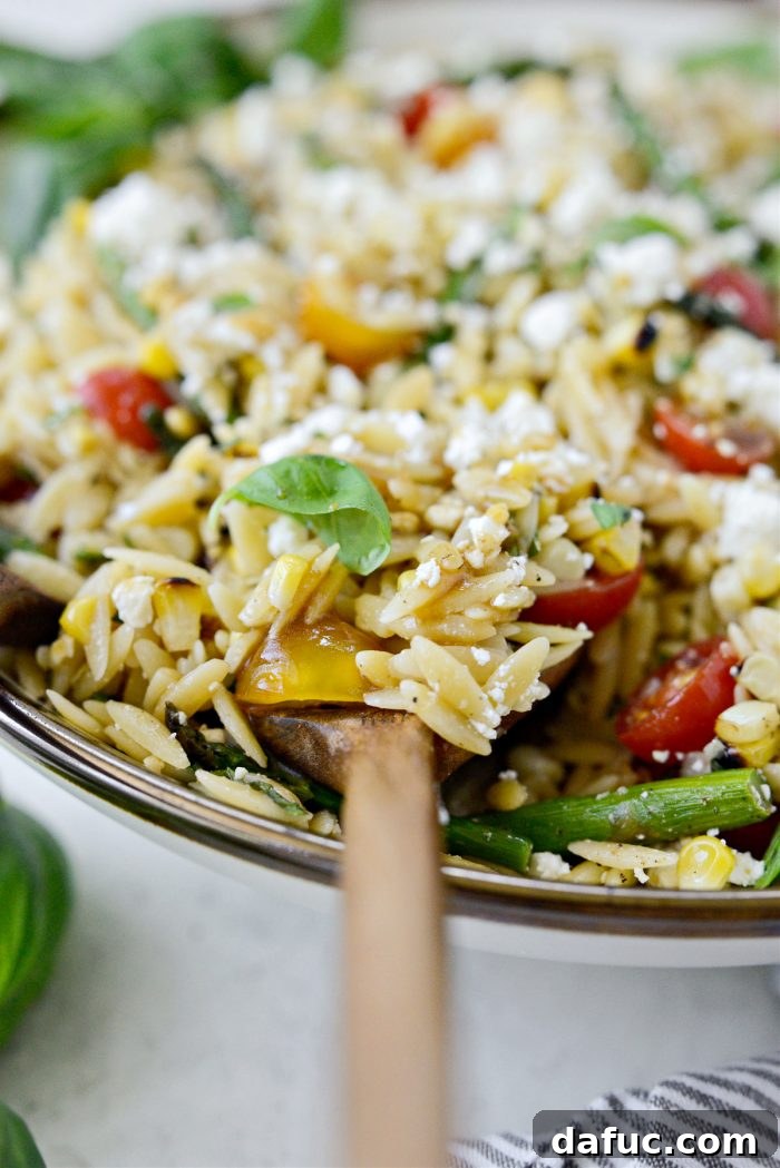 Vibrant Grilled Corn Orzo Salad 20 A final, close-up shot of the Asparagus Tomato and Grilled Corn Orzo Pasta Salad, garnished and ready for enjoyment.