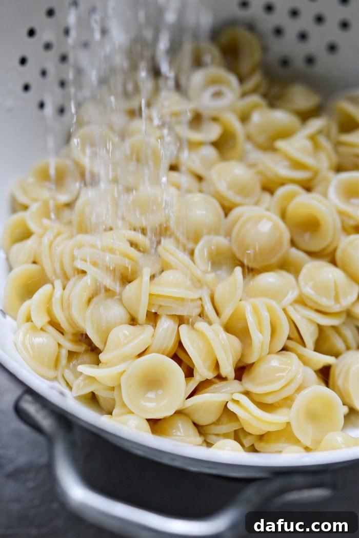Garden Fresh Caprese Pasta 9 Rinsing cooked pasta with cold water