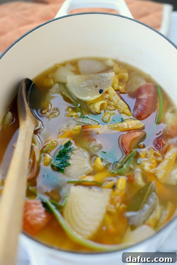 Simmering homemade shrimp stock for maximum flavor extraction