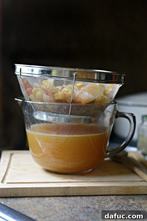 Freshly strained homemade shrimp stock, ready for use