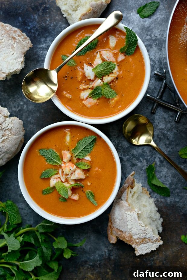 Delicious Roasted Tomato Curry Soup Served with Fresh Mint