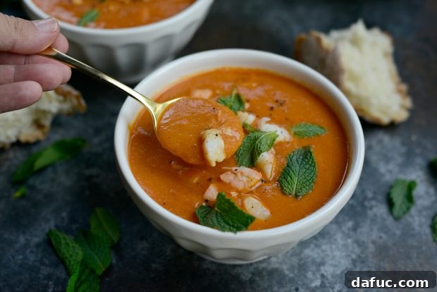 Finished Roasted Tomato Curry Soup with Fresh Mint Garnish