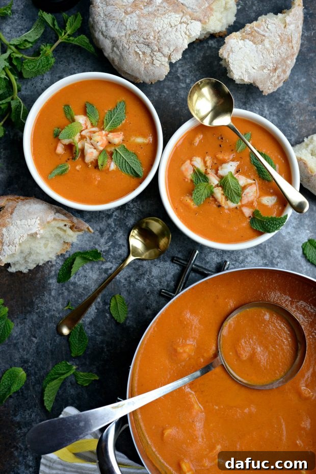 Adding Cooked Shrimp to the Warming Roasted Tomato Curry Soup