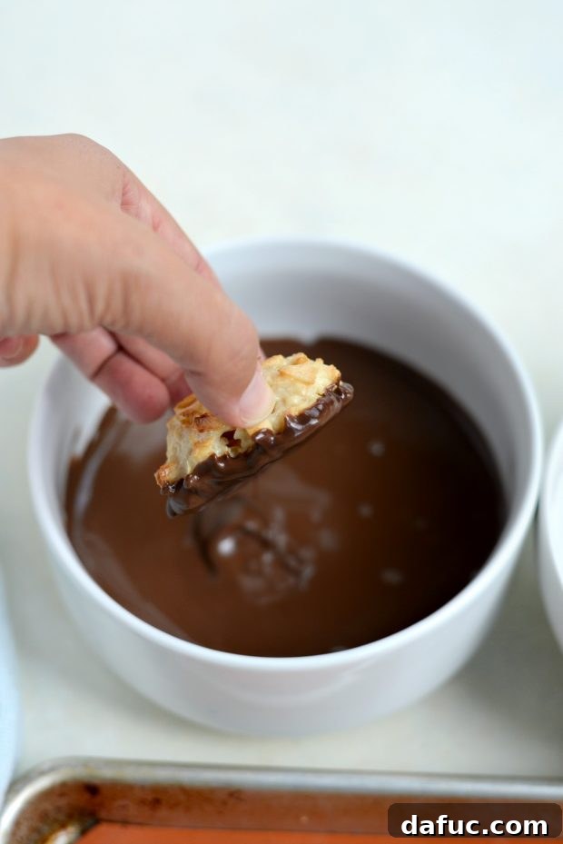 Blissful Almond Macarons 9 dip bottom of cookies in melted chocolate almond bark