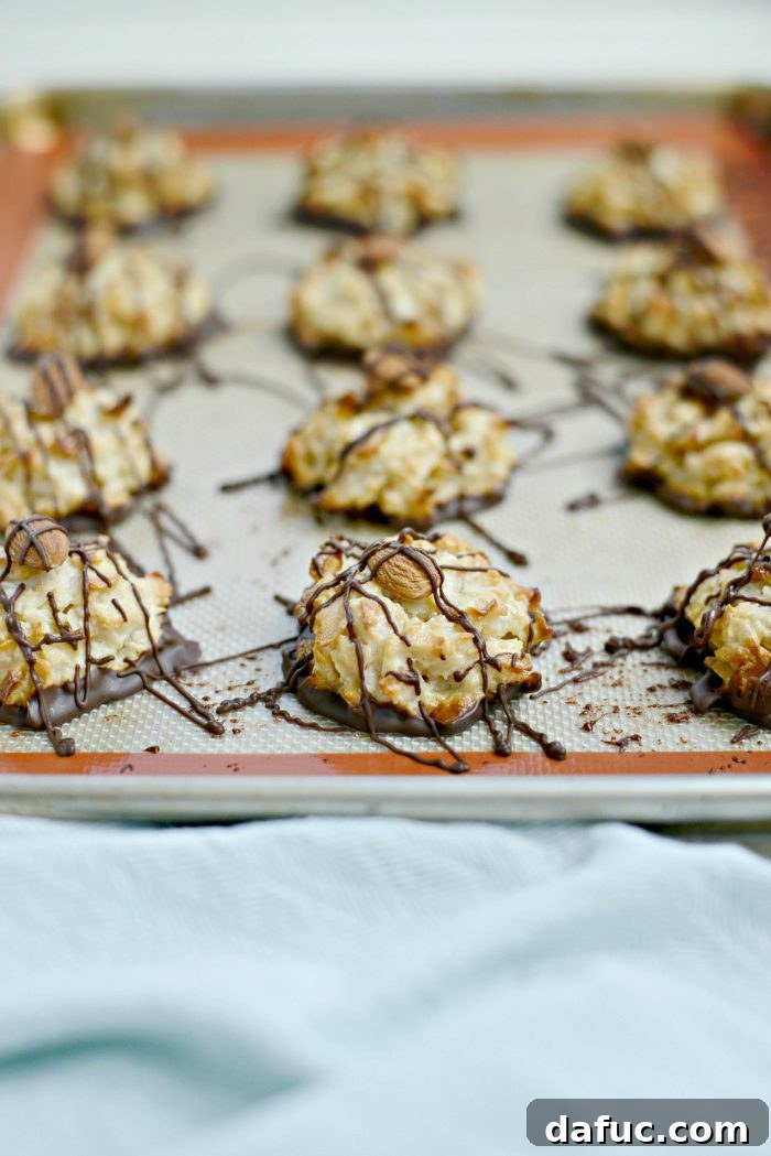 Blissful Almond Macarons 10 top macaroons with an almond and drizzle with melted chocolate