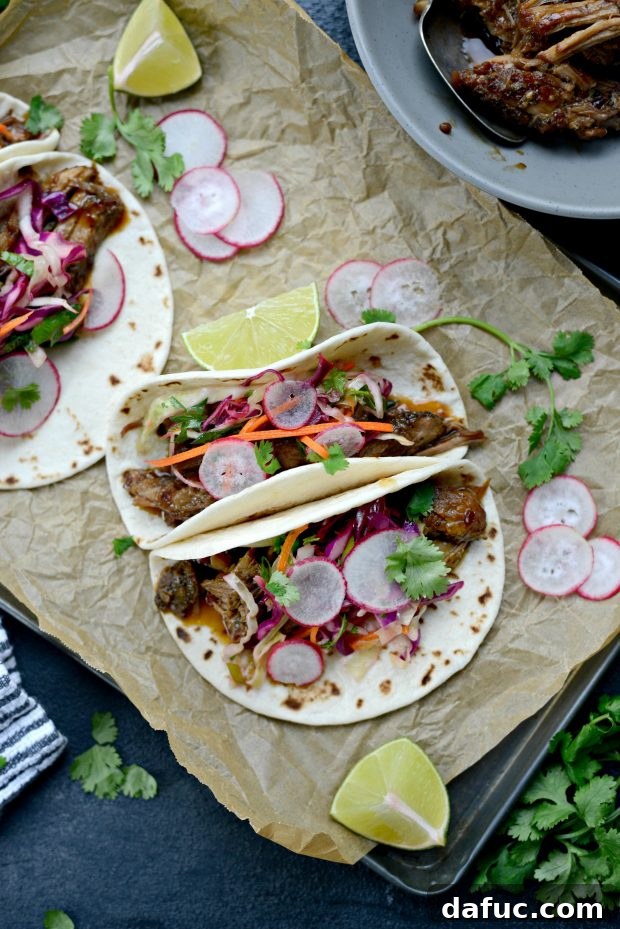 Korean Braised Pork Tacos 3 Braised Korean Pork Tacos with vibrant cilantro slaw, showing the perfect blend of ingredients for a fresh and flavorful meal.