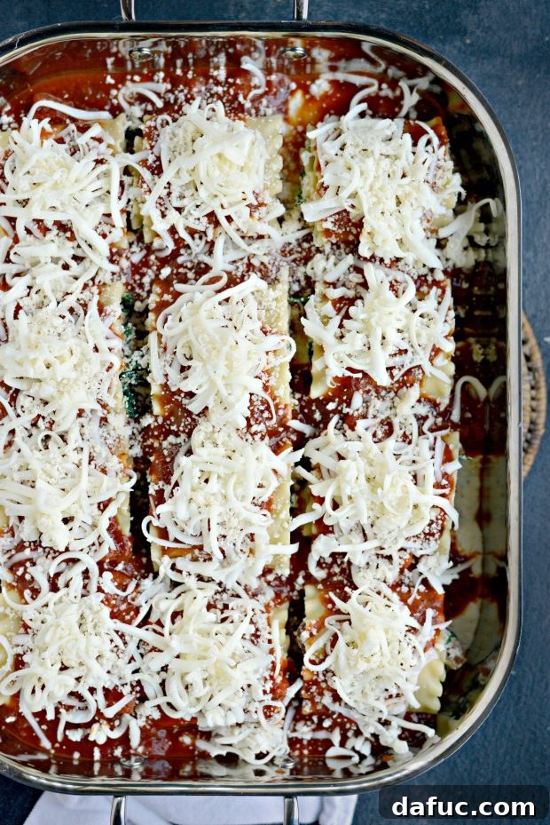 Freshly grated mozzarella and Parmesan cheese sprinkled over the lasagna roll-ups before baking