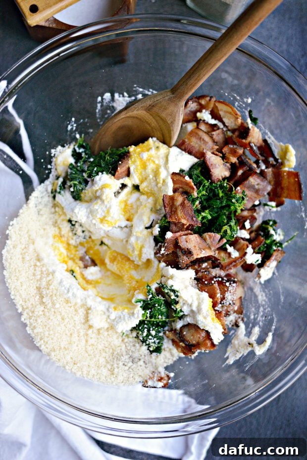 The spinach, ricotta, and bacon filling after being mixed in a bowl