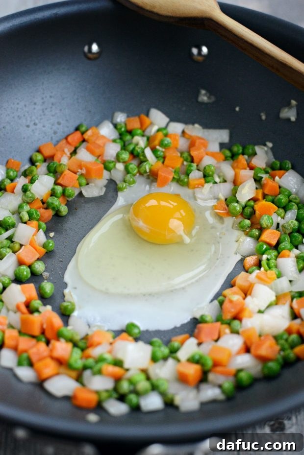 Adding Egg to Tender Vegetables in Wok