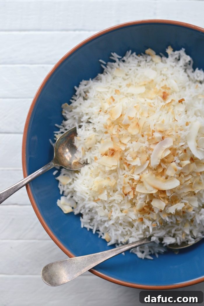 Effortless Rice Cooker Coconut Rice 2 Fluffy Rice Cooker Coconut Rice served in a bowl, ready to be enjoyed.