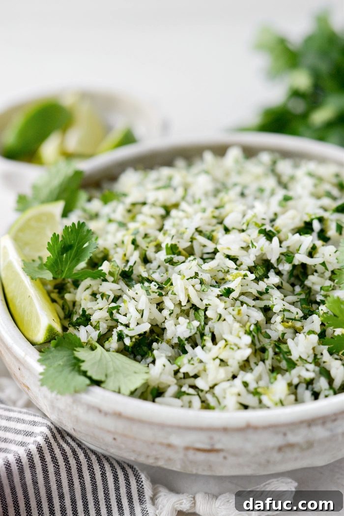 Close-up of fluffy Cilantro Lime Rice with vibrant green cilantro specks