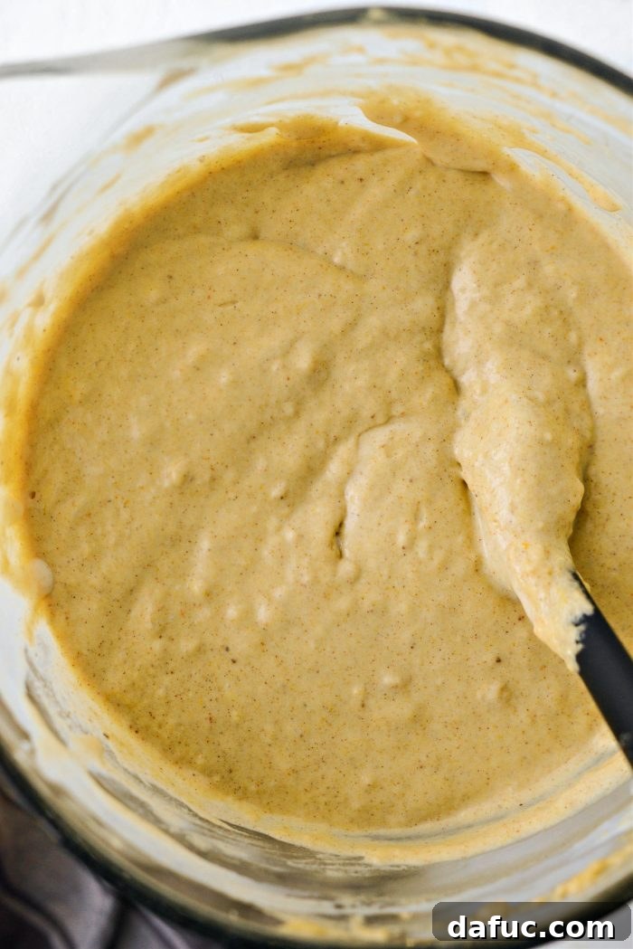 Spiced Brown Butter Pumpkin Pancakes 12 The perfectly mixed brown butter pumpkin pancake batter, showcasing its consistency and readiness for the griddle.