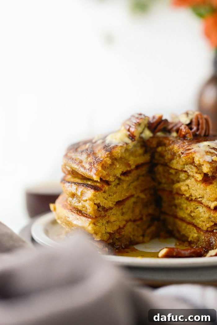 Spiced Brown Butter Pumpkin Pancakes 17 A final, mouth-watering close-up of a stack of Brown Butter Pumpkin Pancakes, tempting viewers with their fluffy texture and delicious appearance.