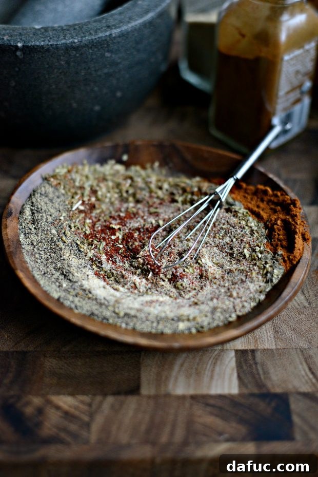 Spice Up Your Kitchen: 20+ Homemade Blends 10 Cajun Seasoning blend in a small jar with a spoon