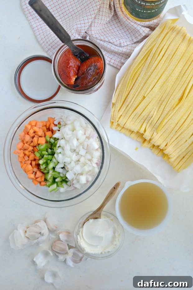 Velvety Roasted Red Pepper Pasta 4 Ingredients for Creamy Roasted Red Pepper Pasta on a Countertop