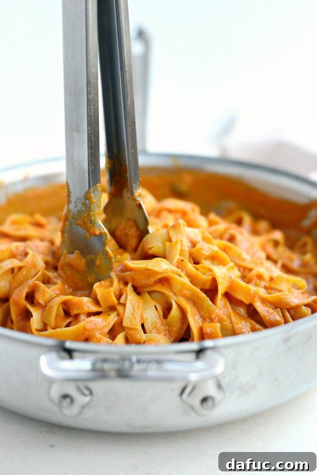 Velvety Roasted Red Pepper Pasta 9 Tossing Pasta with Creamy Roasted Red Pepper Sauce