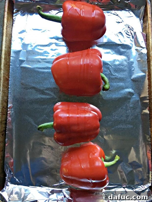 Red peppers on foil lined rimmed pan