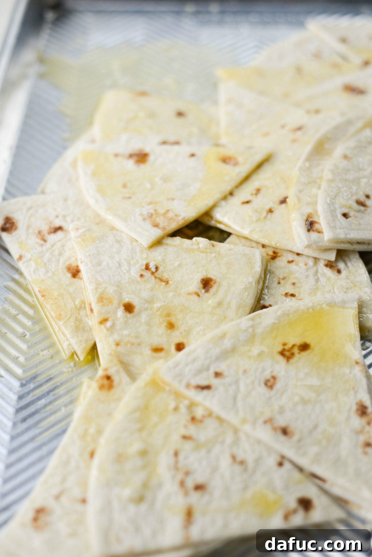 buttered tortilla triangles